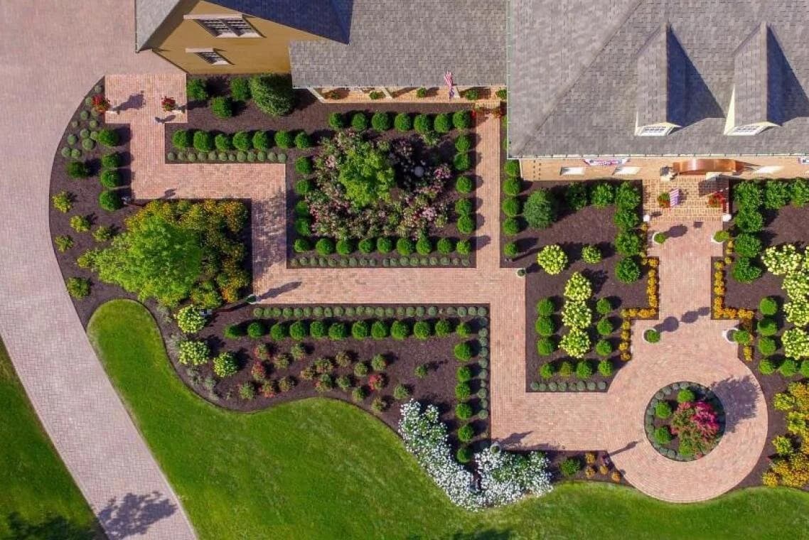 Custom landscape design with pergola and seating area