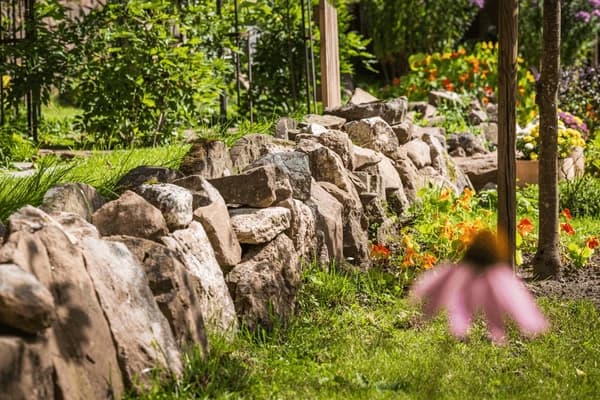 Stacked natural stone retaining wall