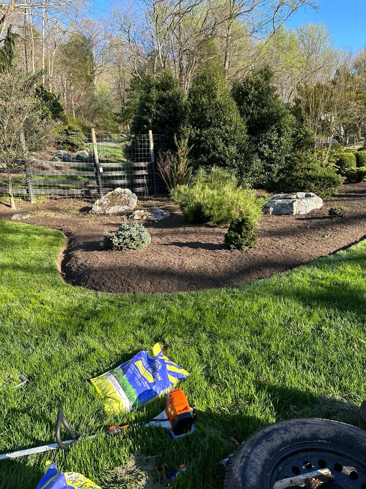 Fresh premium mulch applied around garden beds